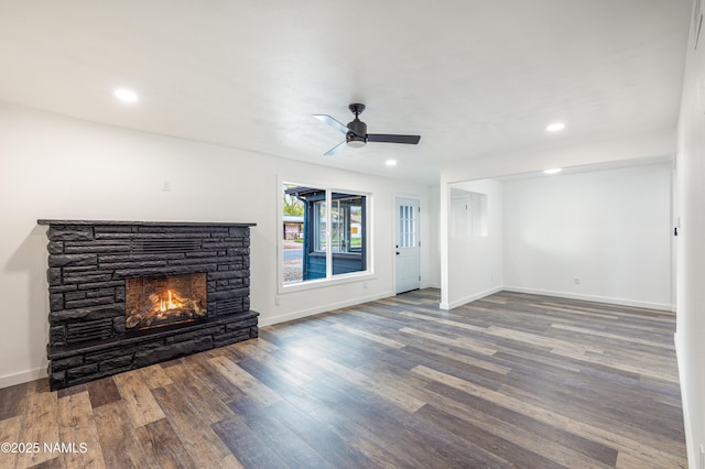 2814 N Patterson Blvd, Flagstaff, AZ 86004 - unfurnished living room with a fireplace, a ceiling fan, wood finished floors, baseboards, and recessed lighting