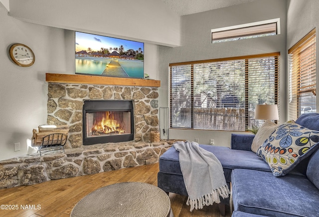 4003 N Goodwin Cir, Flagstaff, AZ 86004 - living area with hardwood / wood-style floors and a stone fireplace