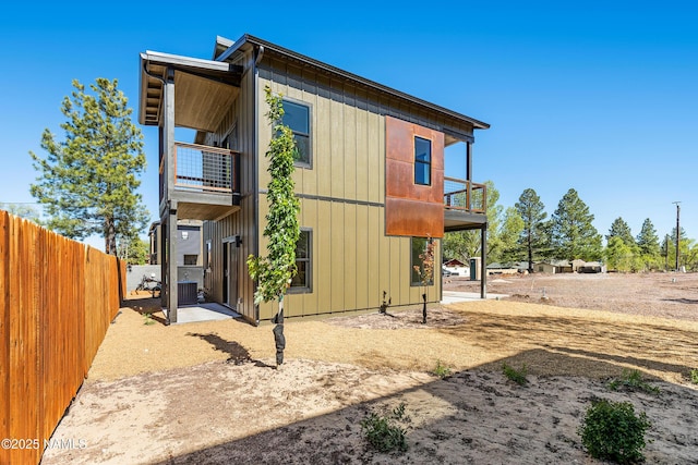 302 W Oak Ave Unit 5, Flagstaff, AZ 86001 - view of property exterior with a balcony, a patio area, and central AC unit