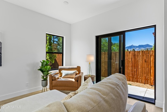 302 W Oak Ave Unit 5, Flagstaff, AZ 86001 - living area featuring light wood-type flooring, baseboards, and a mountain view