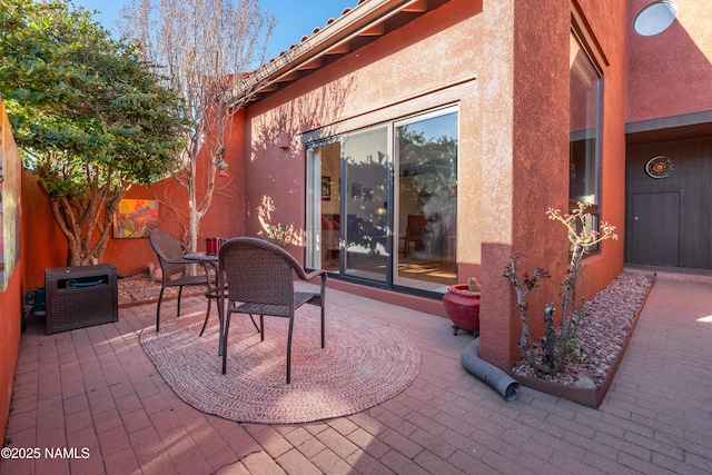 view of patio with outdoor dining space and a fenced backyard