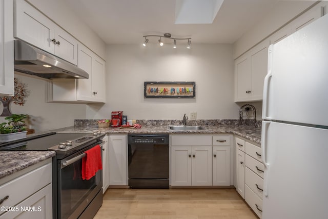 kitchen with under cabinet range hood, electric range, a sink, freestanding refrigerator, and dishwasher