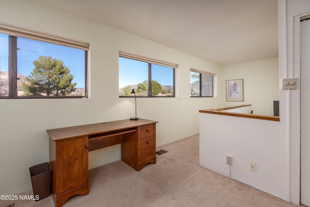 home office featuring light carpet and visible vents