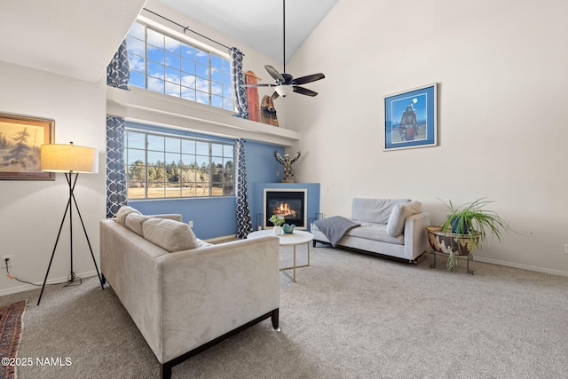 living room featuring carpet flooring, high vaulted ceiling, and ceiling fan