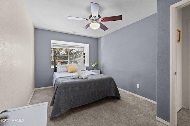 carpeted bedroom featuring ceiling fan