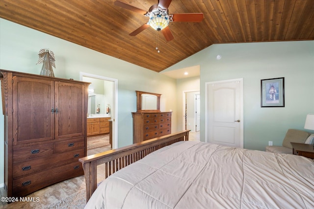 bedroom featuring ceiling fan, ensuite bathroom, wood ceiling, and vaulted ceiling