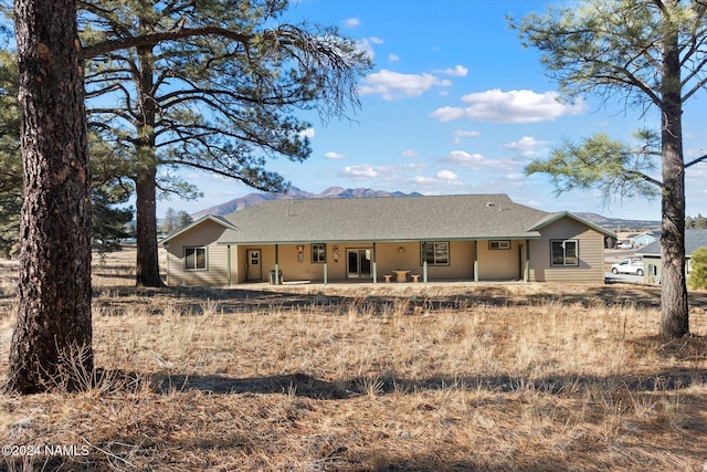 rear view of property featuring a patio area