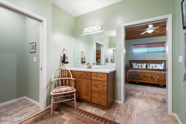 bathroom with ceiling fan and vanity