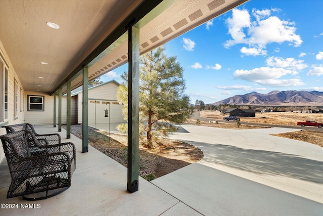 view of patio / terrace with a mountain view