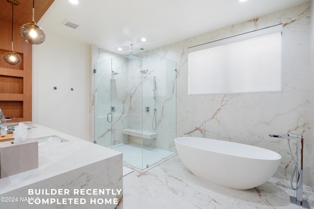 bathroom with recessed lighting, visible vents, a freestanding bath, marble finish floor, and a marble finish shower