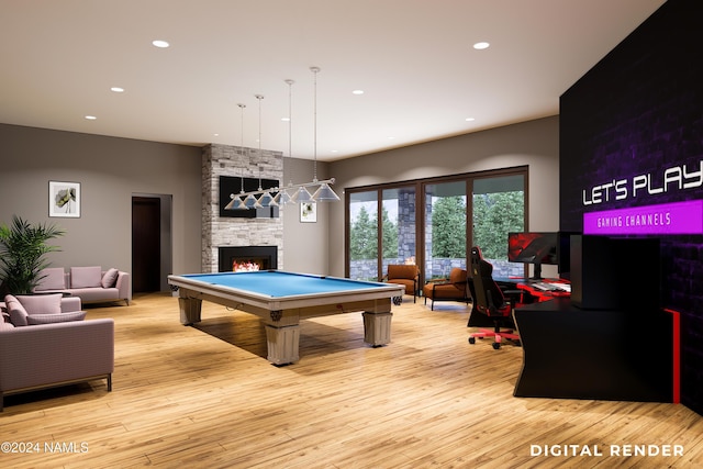 recreation room featuring recessed lighting, light wood-style floors, billiards, and a stone fireplace