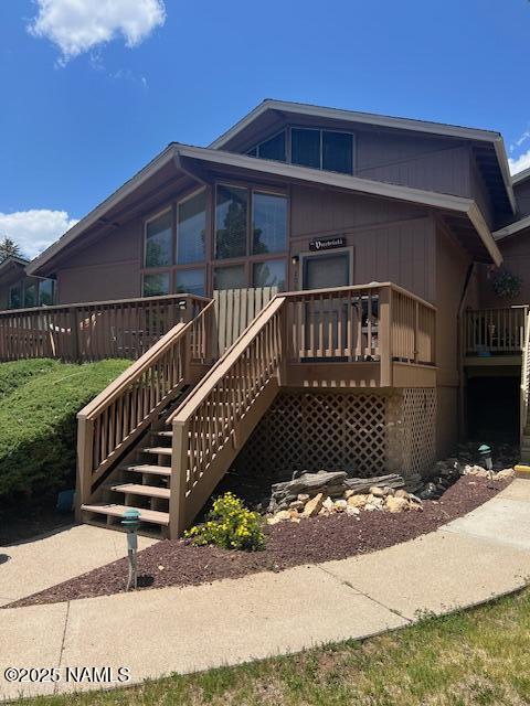 2065 N Country Club Dr, Flagstaff, AZ 86004 - view of front of property with stairs and a wooden deck