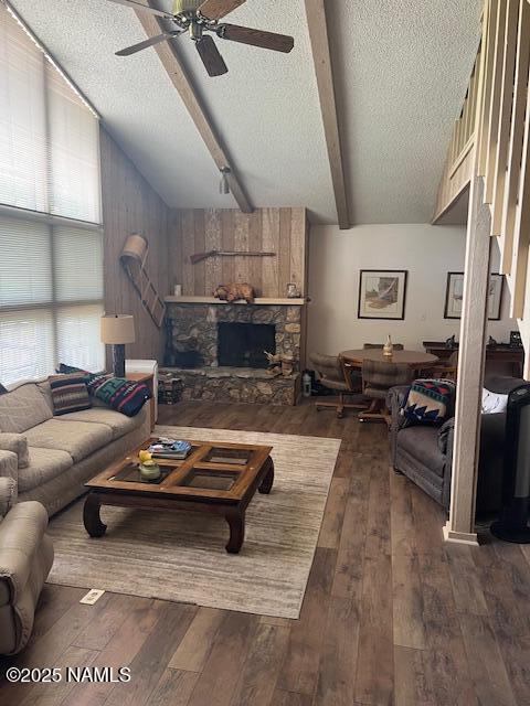 2065 N Country Club Dr, Flagstaff, AZ 86004 - living area featuring a textured ceiling, hardwood / wood-style flooring, ceiling fan, and a fireplace
