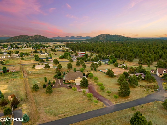 10833 Sage Rd, Flagstaff, AZ 86004 - aerial view at dusk with a wooded view and a mountain view