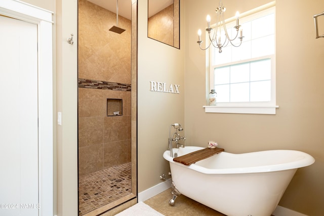 10833 Sage Rd, Flagstaff, AZ 86004 - full bath featuring a freestanding bath, baseboards, a tile shower, and a chandelier