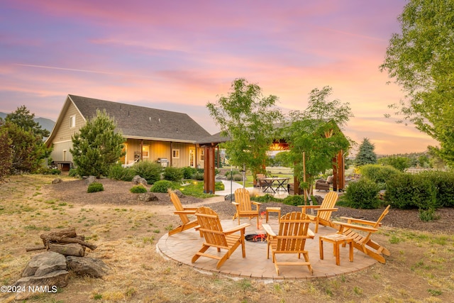 10833 Sage Rd, Flagstaff, AZ 86004 - back of property at dusk with a patio