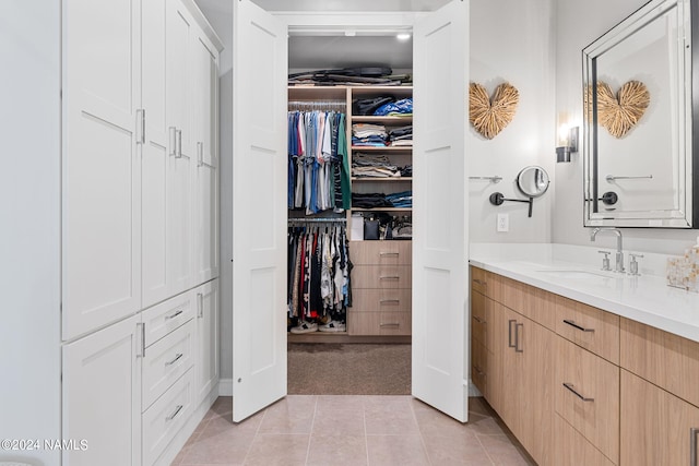 bathroom featuring tile patterned floors and vanity