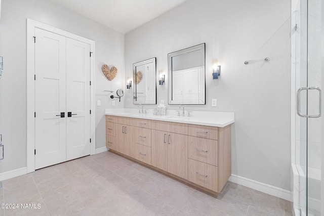 bathroom featuring tile patterned flooring, walk in shower, and vanity