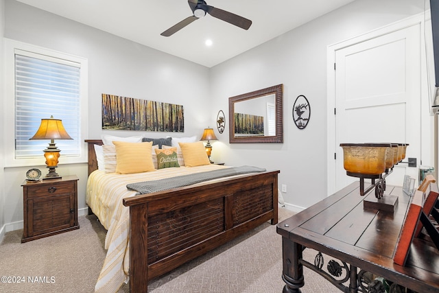 carpeted bedroom with ceiling fan