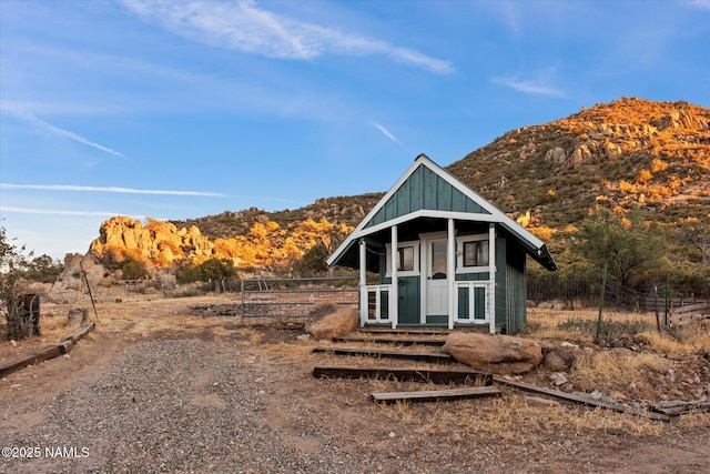 view of outbuilding featuring a mountain view