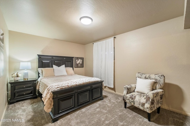 carpeted bedroom featuring a textured ceiling