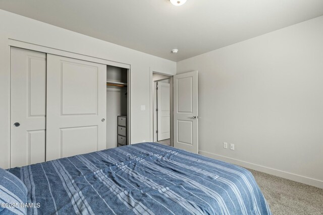 12220 Curtis Ct, Bellemont, AZ 86015 - carpeted bedroom featuring a closet and baseboards