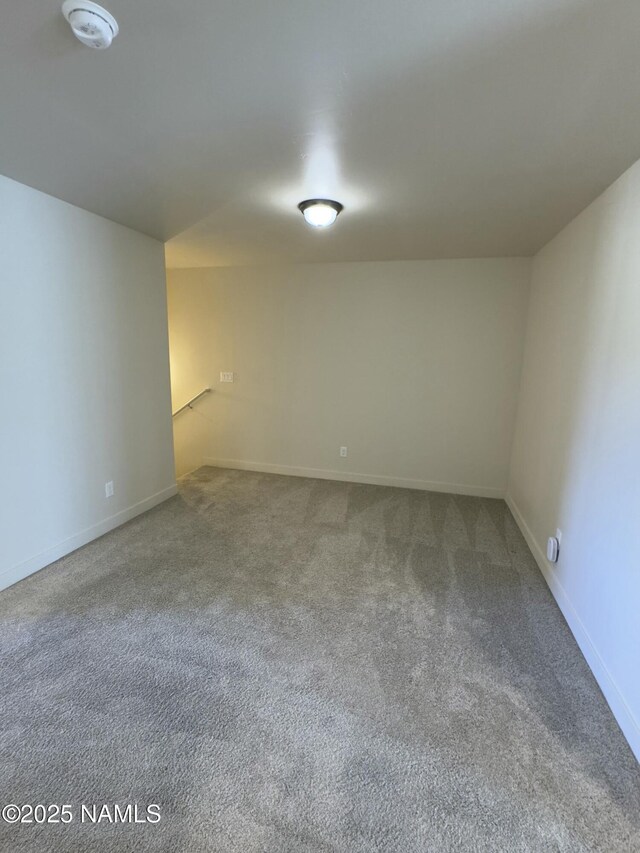 12220 Curtis Ct, Bellemont, AZ 86015 - carpeted empty room with baseboards