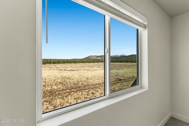 12220 Curtis Ct, Bellemont, AZ 86015 - doorway featuring a mountain view and baseboards