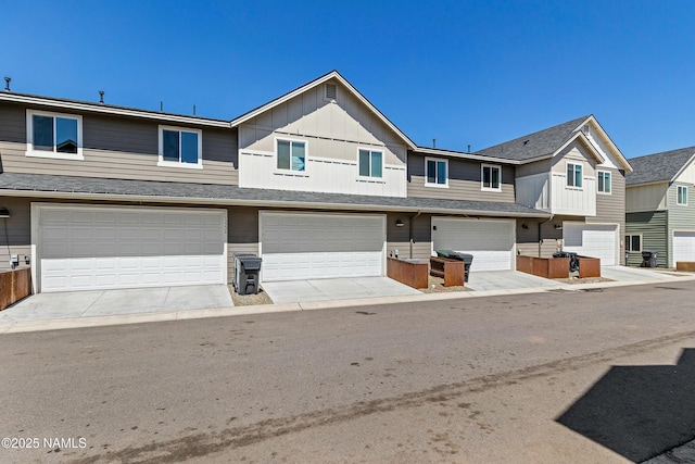 12220 Curtis Ct, Bellemont, AZ 86015 - townhome / multi-family property featuring an attached garage, board and batten siding, and a shingled roof