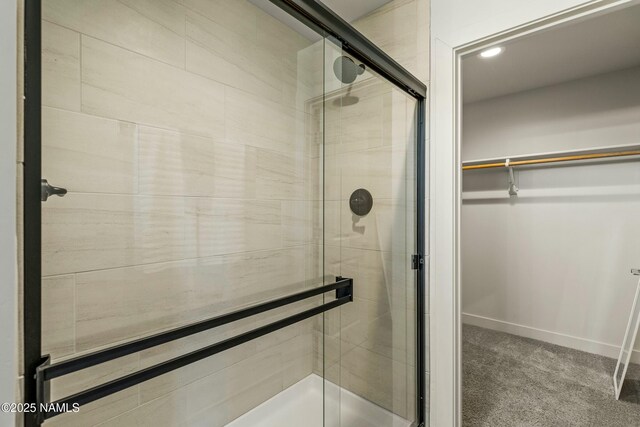 12220 Curtis Ct, Bellemont, AZ 86015 - full bath featuring a spacious closet, baseboards, recessed lighting, and a stall shower