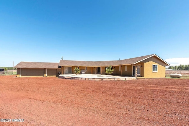 single story home featuring a patio area