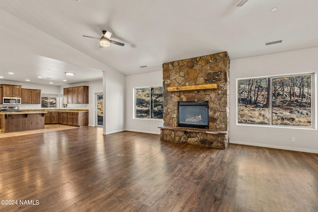 3330 Granite Rdg Lot 4, Flagstaff, AZ 86001 - unfurnished living room with a stone fireplace, a ceiling fan, dark wood-style floors, lofted ceiling, and baseboards