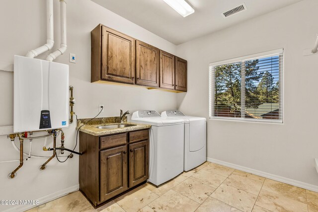 3330 Granite Rdg Lot 4, Flagstaff, AZ 86001 - washroom with cabinet space, washing machine and clothes dryer, tankless water heater, and baseboards
