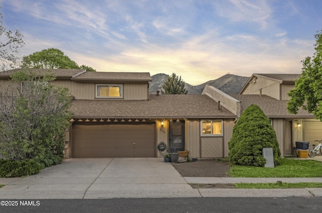 2550 E Cassidy Ln, Flagstaff, AZ 86004 - view of front facade with driveway, a shingled roof, and a garage