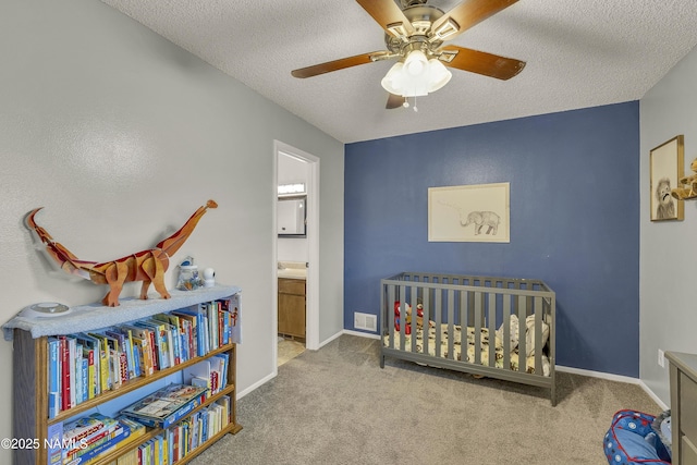 2550 E Cassidy Ln, Flagstaff, AZ 86004 - carpeted bedroom with a textured ceiling, ceiling fan, baseboards, and connected bathroom