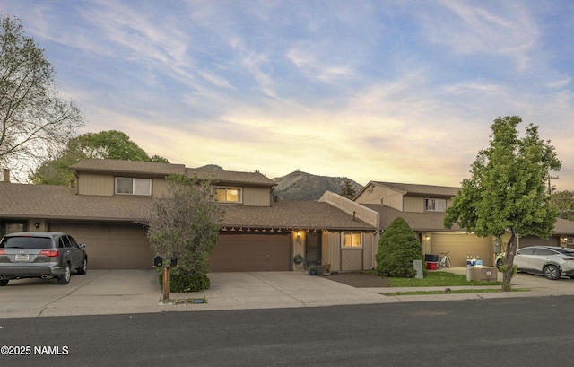 2550 E Cassidy Ln, Flagstaff, AZ 86004 - view of front of home with driveway and an attached garage