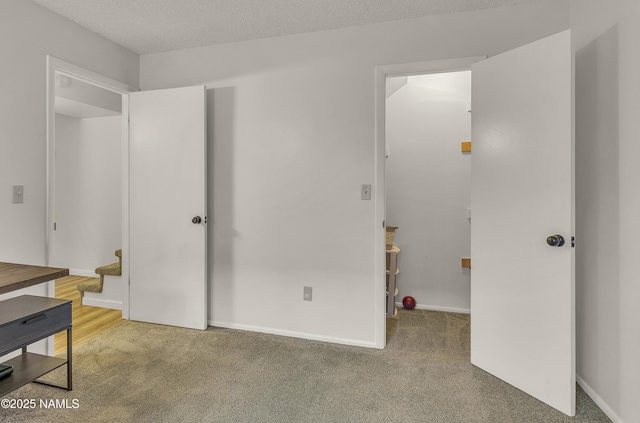 2550 E Cassidy Ln, Flagstaff, AZ 86004 - unfurnished bedroom with carpet flooring and a textured ceiling