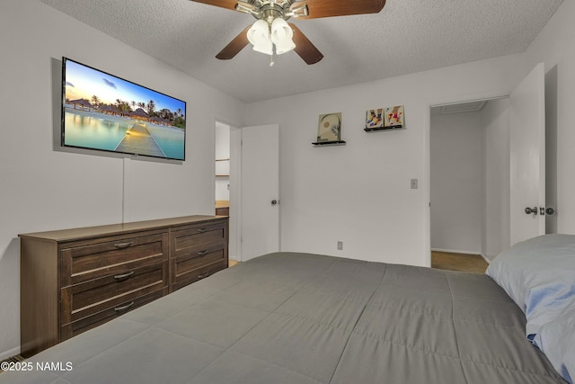 2550 E Cassidy Ln, Flagstaff, AZ 86004 - bedroom featuring a textured ceiling, ceiling fan, and baseboards