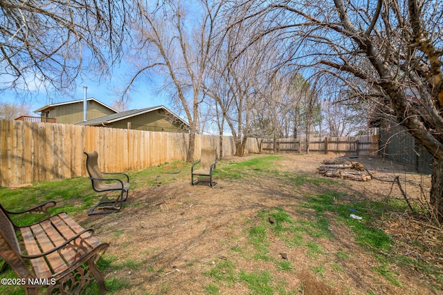 view of yard with a fenced backyard