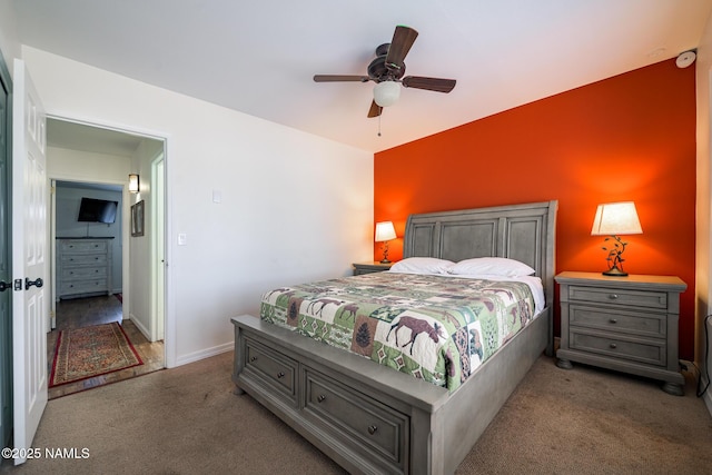 bedroom featuring carpet, baseboards, and ceiling fan
