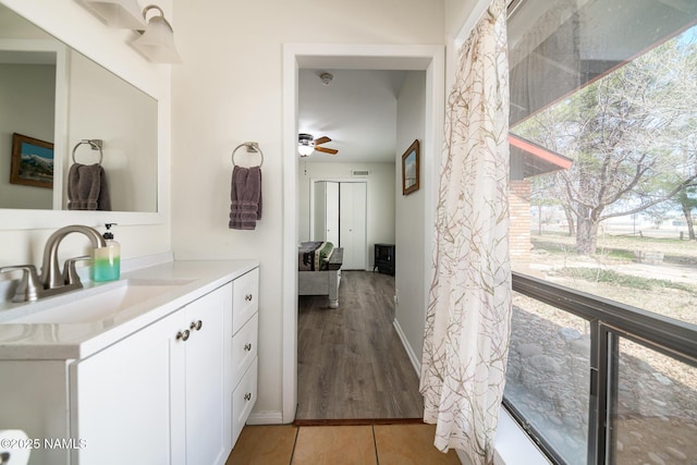 bathroom featuring vanity and a ceiling fan