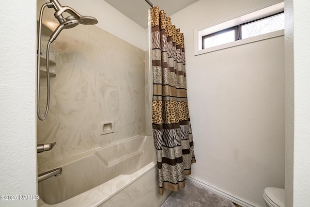 bathroom featuring toilet and shower / tub combo with curtain