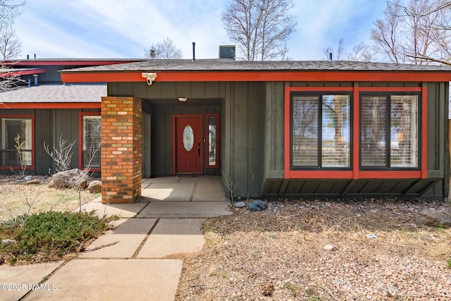 view of front of property featuring board and batten siding and a shingled roof