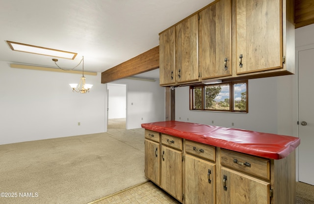5920 Wildflower Rd, Flagstaff, AZ 86004 - kitchen with beam ceiling, light floors, hanging light fixtures, light colored carpet, and an inviting chandelier