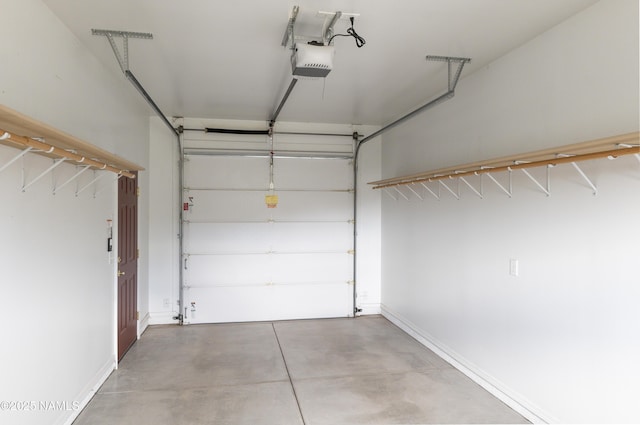 5920 Wildflower Rd, Flagstaff, AZ 86004 - garage with baseboards and a garage door opener
