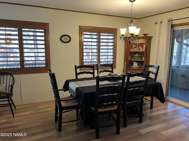 2511 Black Bear Ln, Pine Top, AZ 85935 - dining area with ornamental molding, a chandelier, and wood finished floors