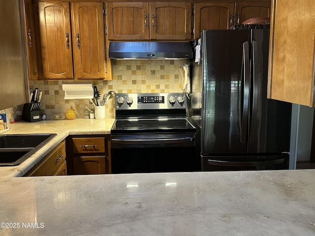 2511 Black Bear Ln, Pine Top, AZ 85935 - kitchen featuring electric stove, under cabinet range hood, freestanding refrigerator, light countertops, and a sink
