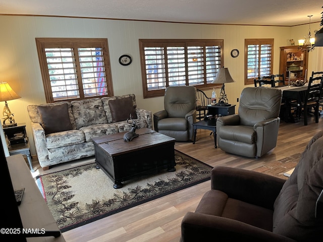 2511 Black Bear Ln, Pine Top, AZ 85935 - living room featuring crown molding, a chandelier, and wood finished floors