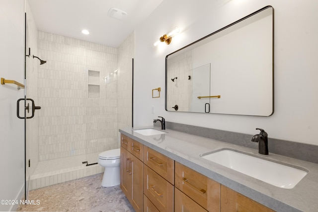 bathroom with vanity, toilet, and walk in shower