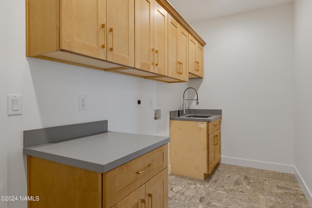 kitchen with sink and light brown cabinetry